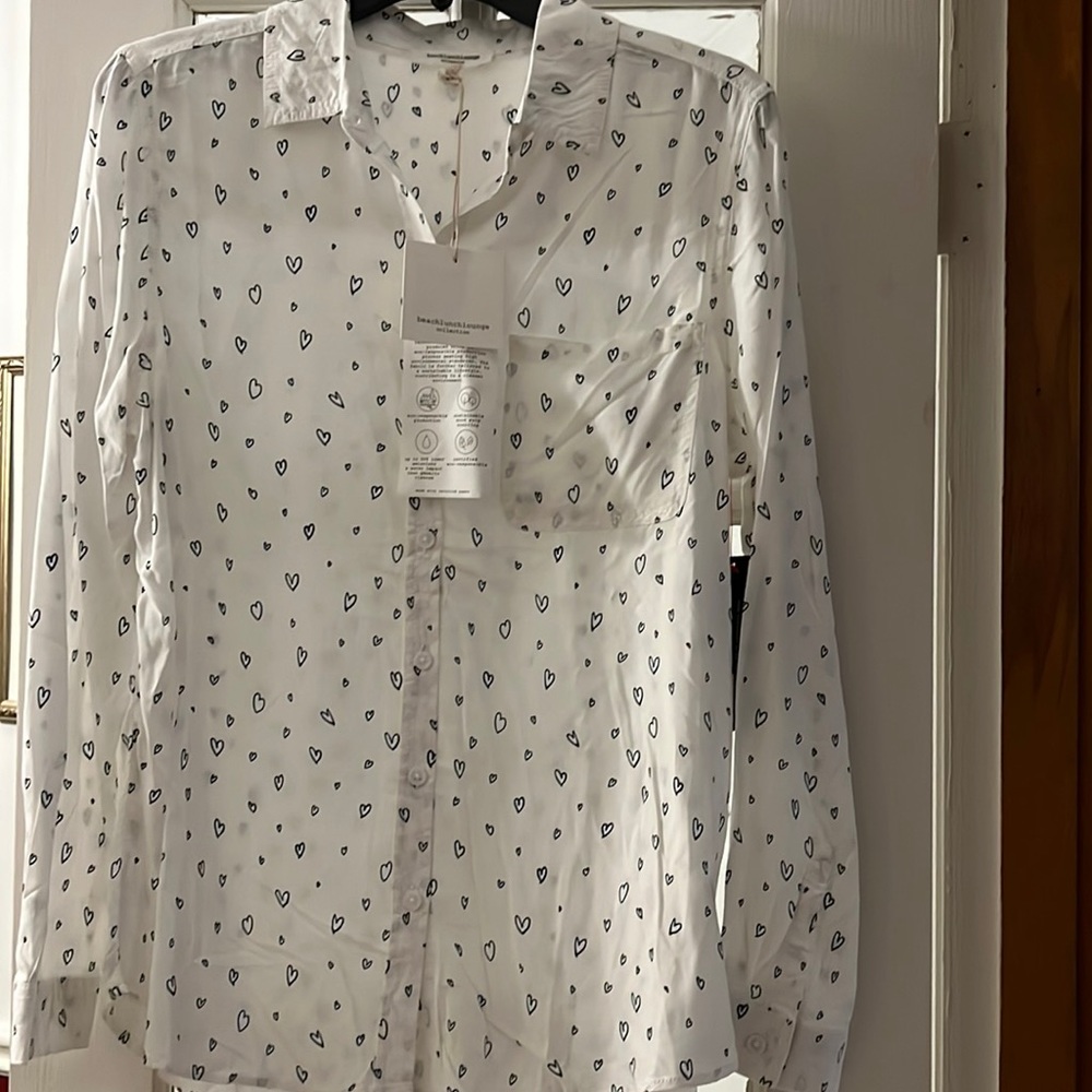 White button down long sleeve blouse with blue hearts.